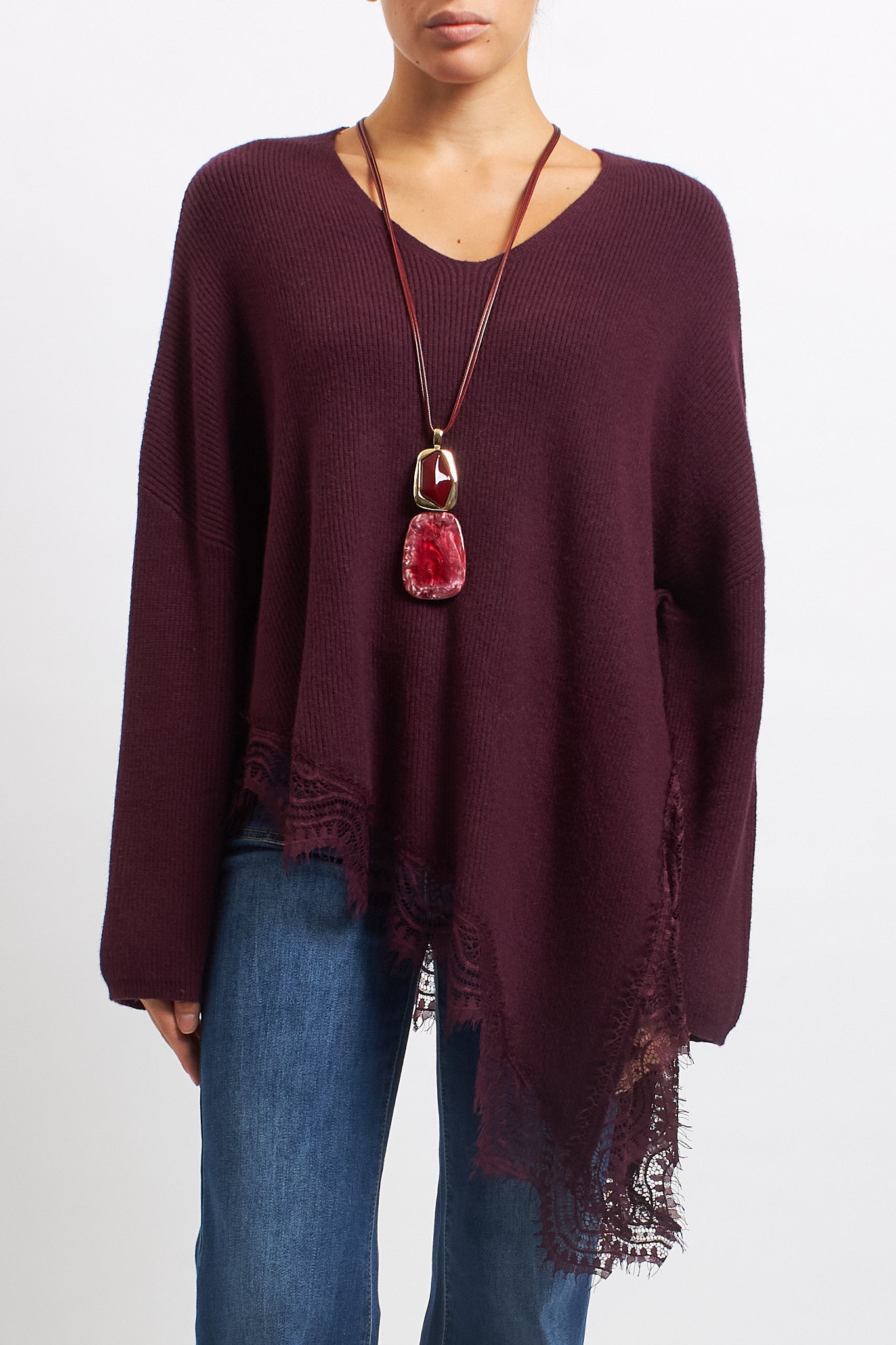 Maglia asimmetrica con inserti in pizzo