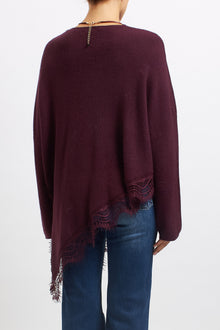 Maglia asimmetrica con inserti in pizzo