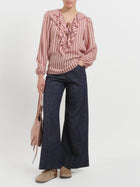 Blusa gessata con collo volant