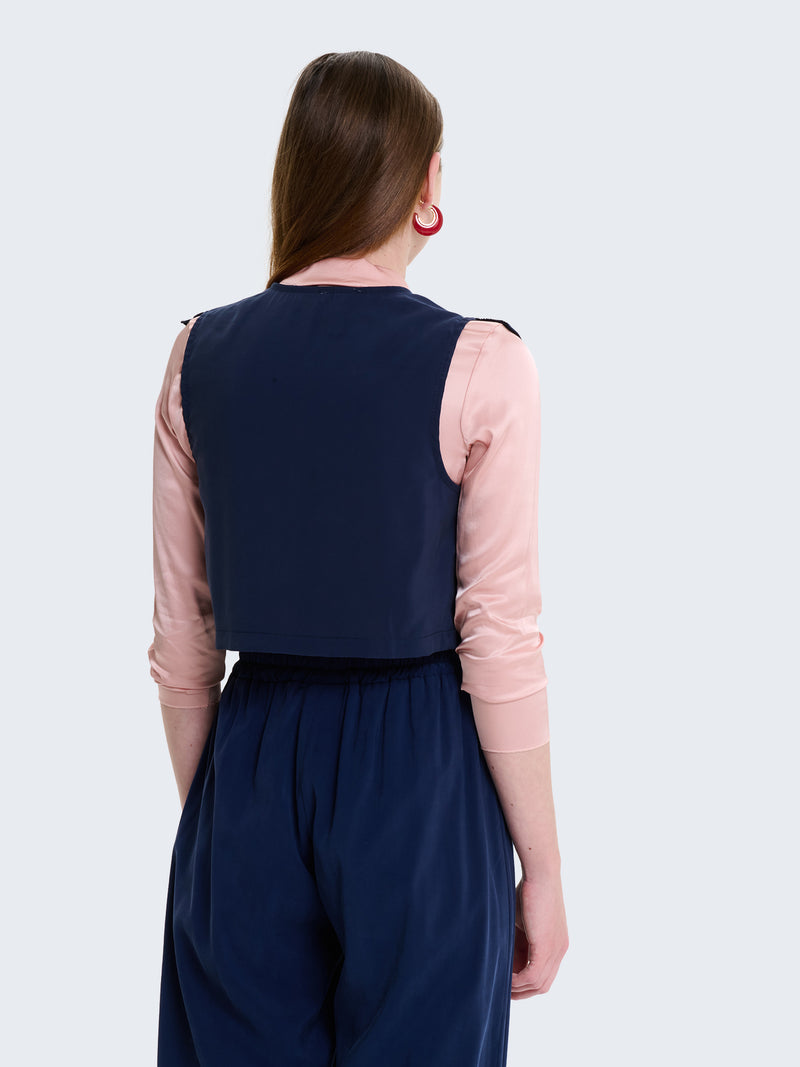 Gilet con laccetti e volant in cupro