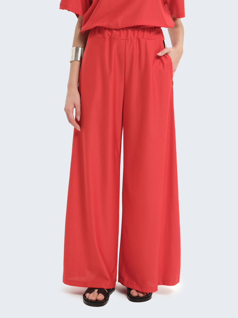 Pantaloni ampi con banda laterale