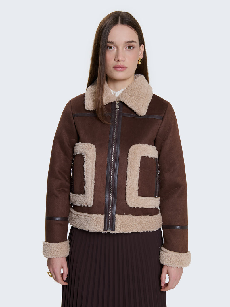 Montone con tasche bordate