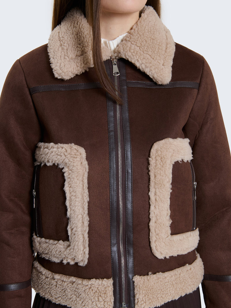 Montone con tasche bordate