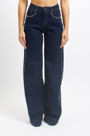 Jeans wide leg con borchie