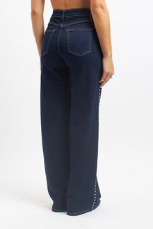 Jeans wide leg con borchie