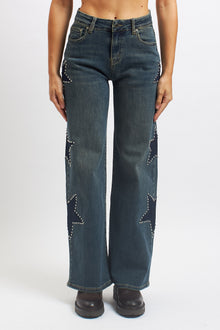 Jeans wide leg con stelle borchiate