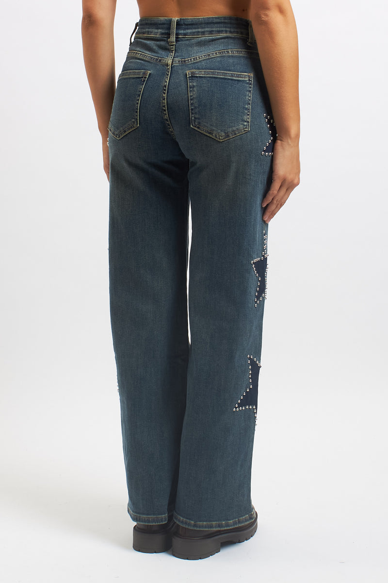Jeans wide leg con stelle borchiate