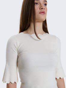 Maglia a costine e bordi a ondine