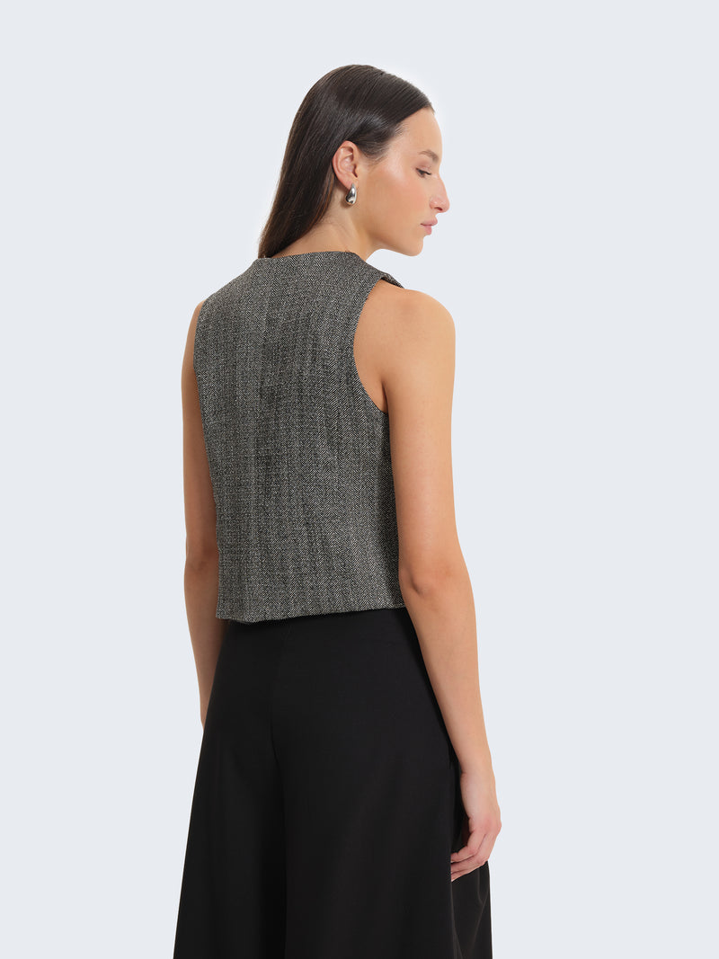 Gilet con tessuto spigato e charms