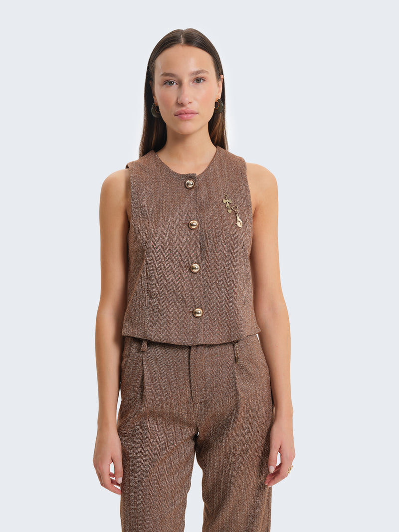 Gilet con tessuto spigato e charms