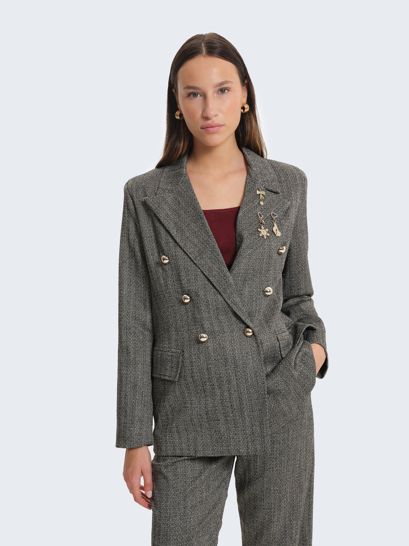 Blazer con tessuto spigato e charms