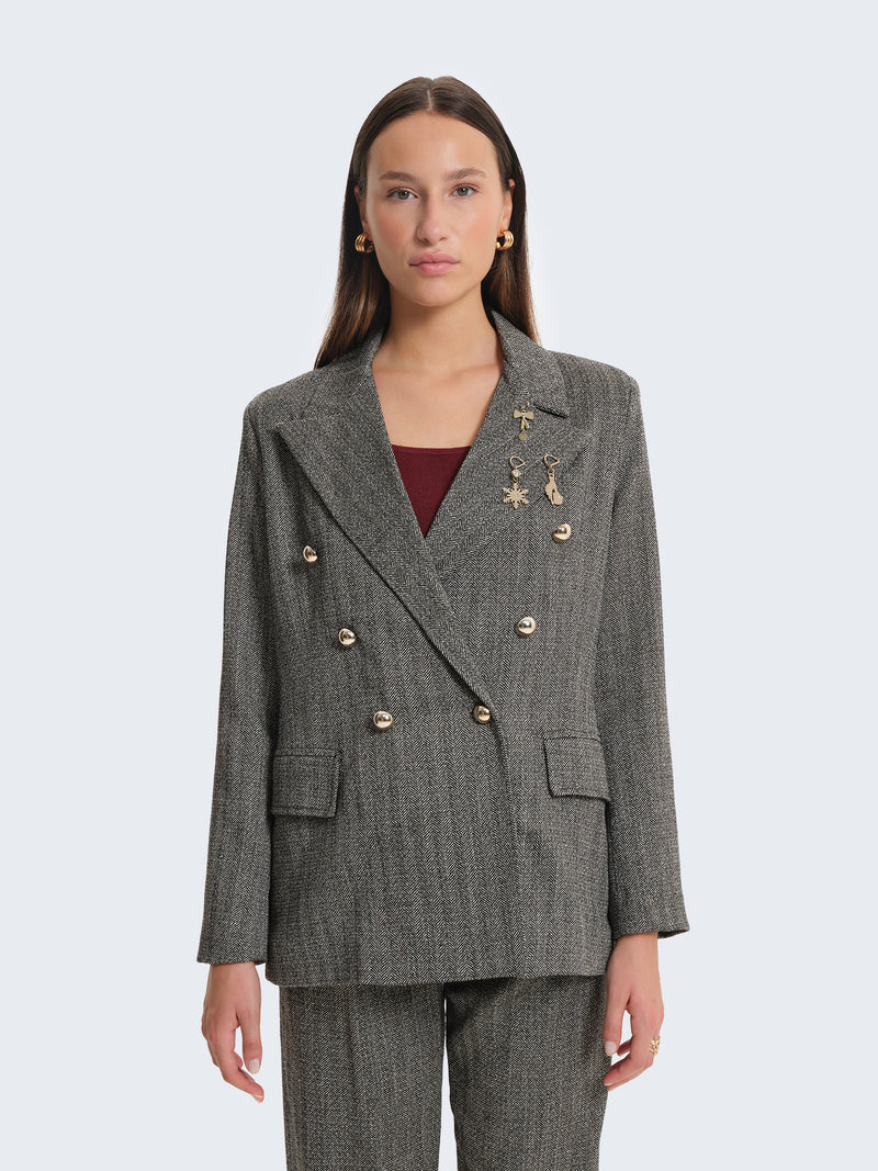 Blazer con tessuto spigato e charms