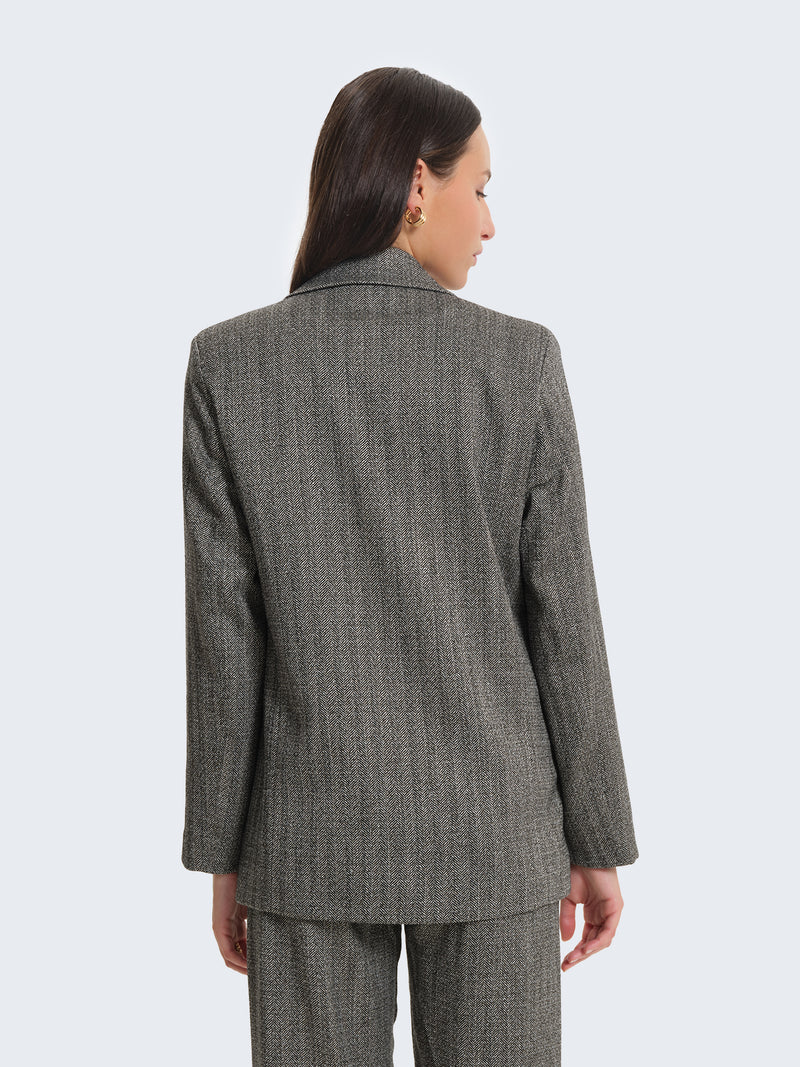 Blazer con tessuto spigato e charms