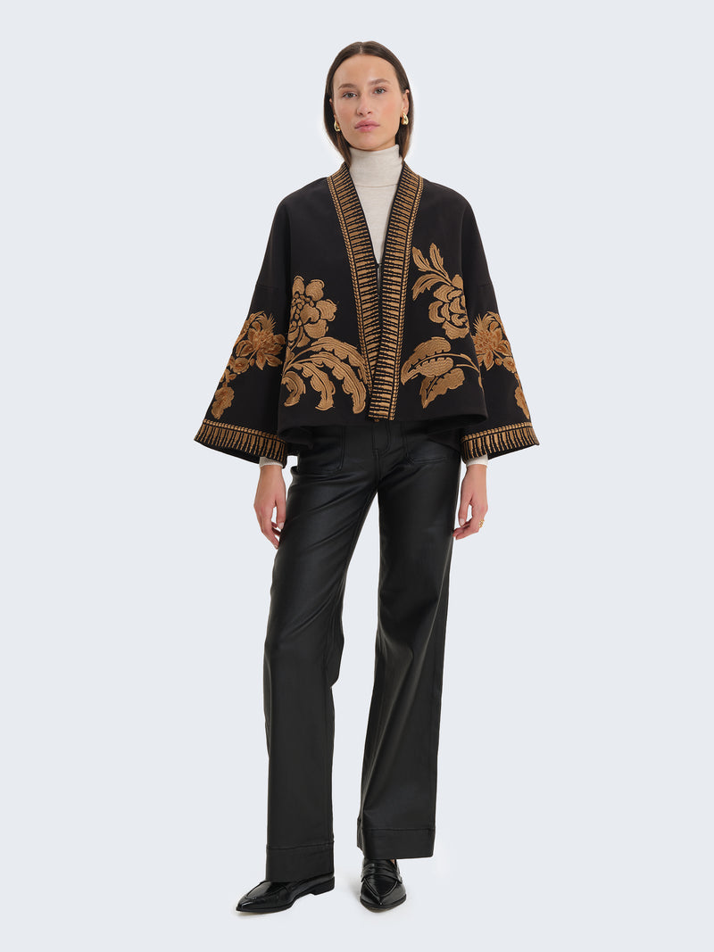 High-waisted faux leather-effect coated palazzo trousers